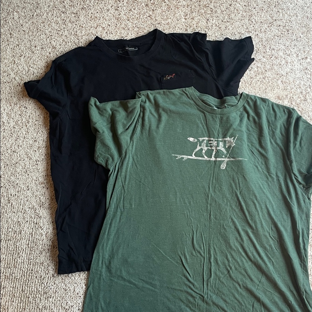 1 Gregg Norman black  and 1 Yeti Green  T-Shirt  (2 shirts total).